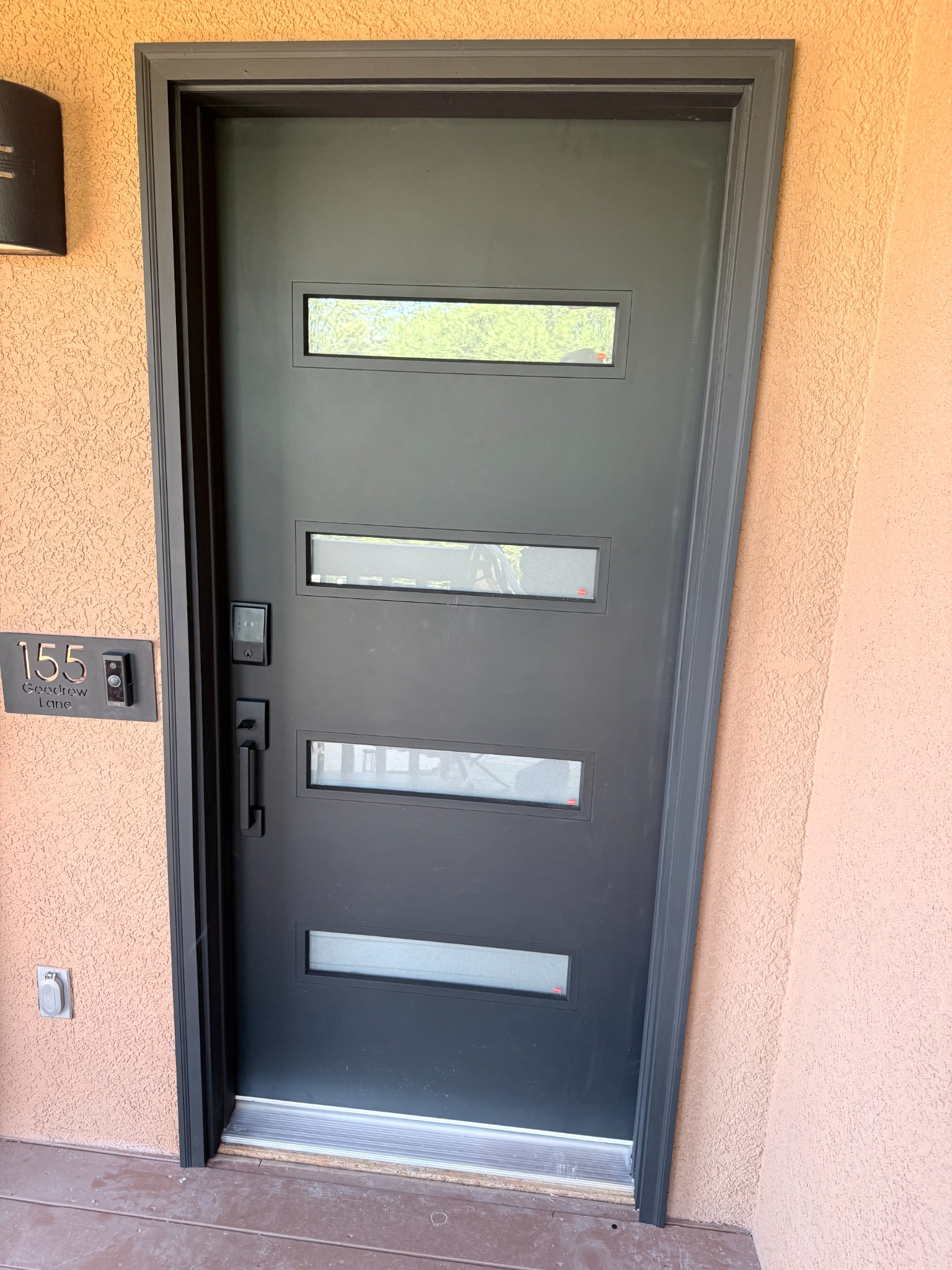 Modern front entry door with horizontal glass panels installed in Sedona, Arizona