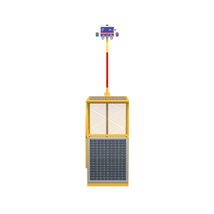 Yellow device with solar panel and electronic component connected by a red wire on white background.