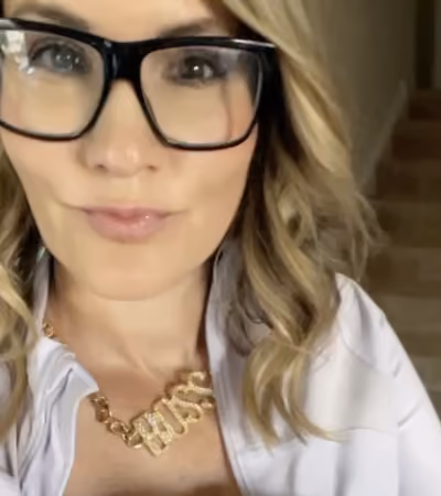 Boss Photo Wall: property manager in glasses and a gold BOSS necklace