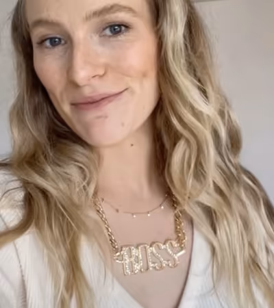 Boss Photo Wall: property manager wearing a gold BOSS necklace