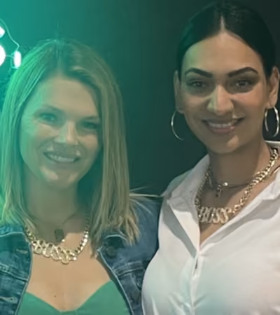 Boss Photo Wall: two property managers in gold BOSS necklaces