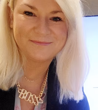 Boss Photo Wall: property manager smiling in a gold BOSS necklace