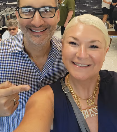 Boss Photo Wall: two industry friends taking a selfie, one wearing a gold BOSS necklace