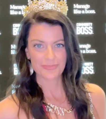 Boss Photo Wall: property manager wearing a crown and BOSS necklace at the Community Boss booth