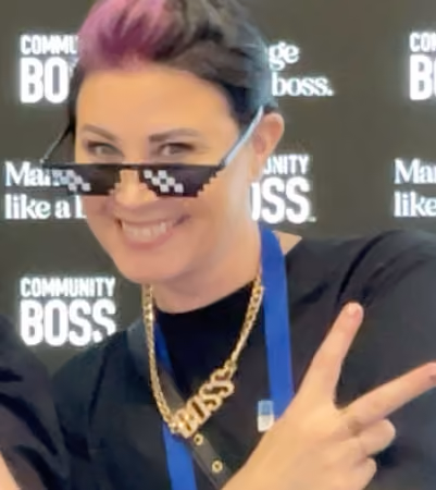 Boss Photo Wall: property manager in sunglasses and a gold BOSS necklace flashing a peace sign