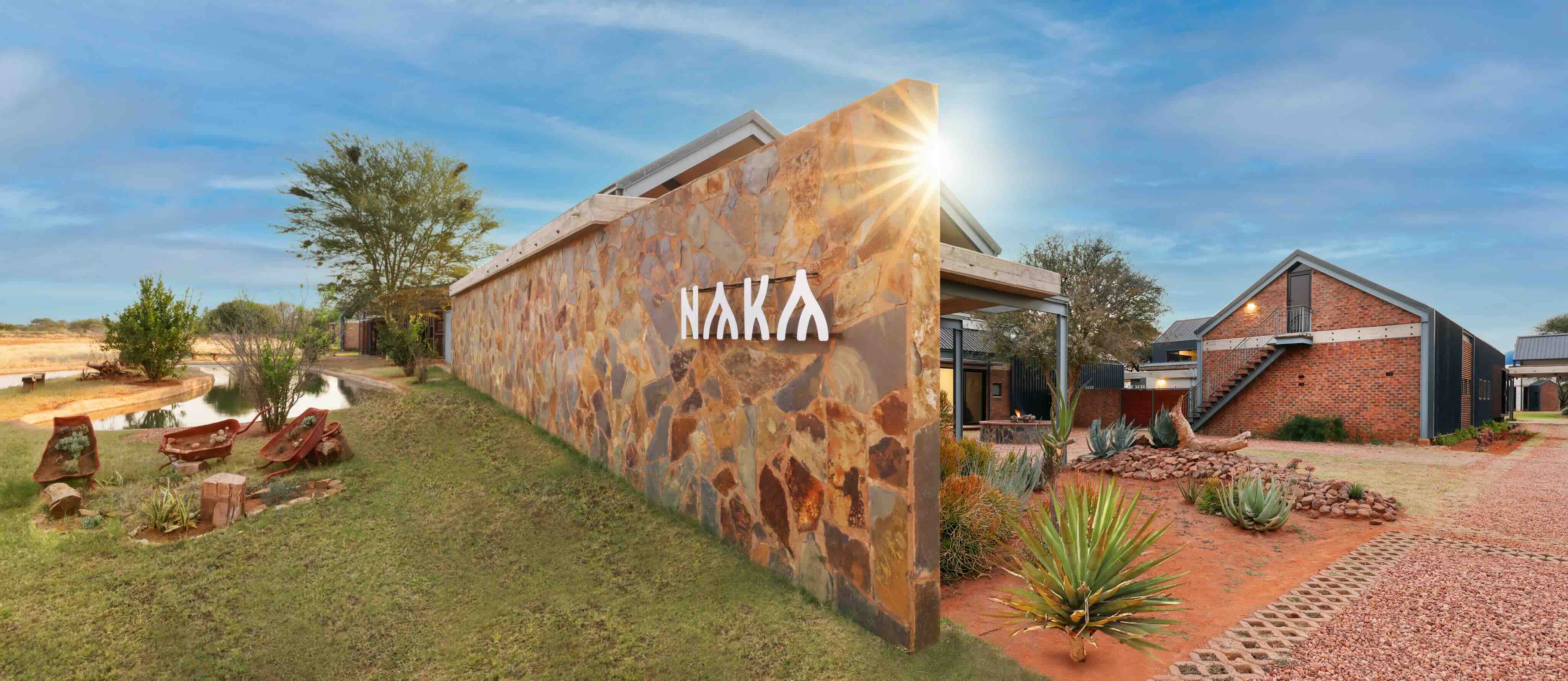 Naka Luxury Lodge Logo on a wall