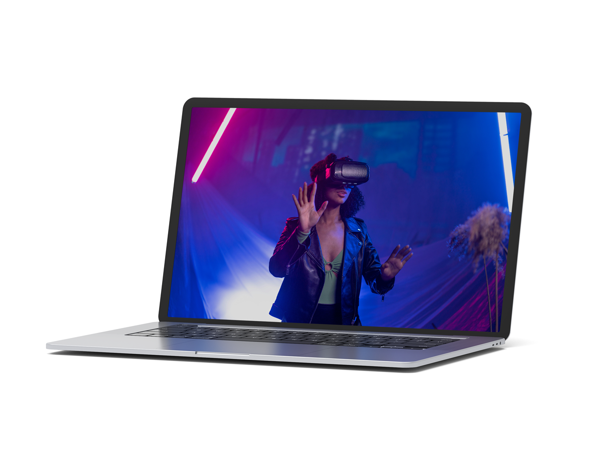 mockup of a macbook that shows a person using AI tools and a VR goggle