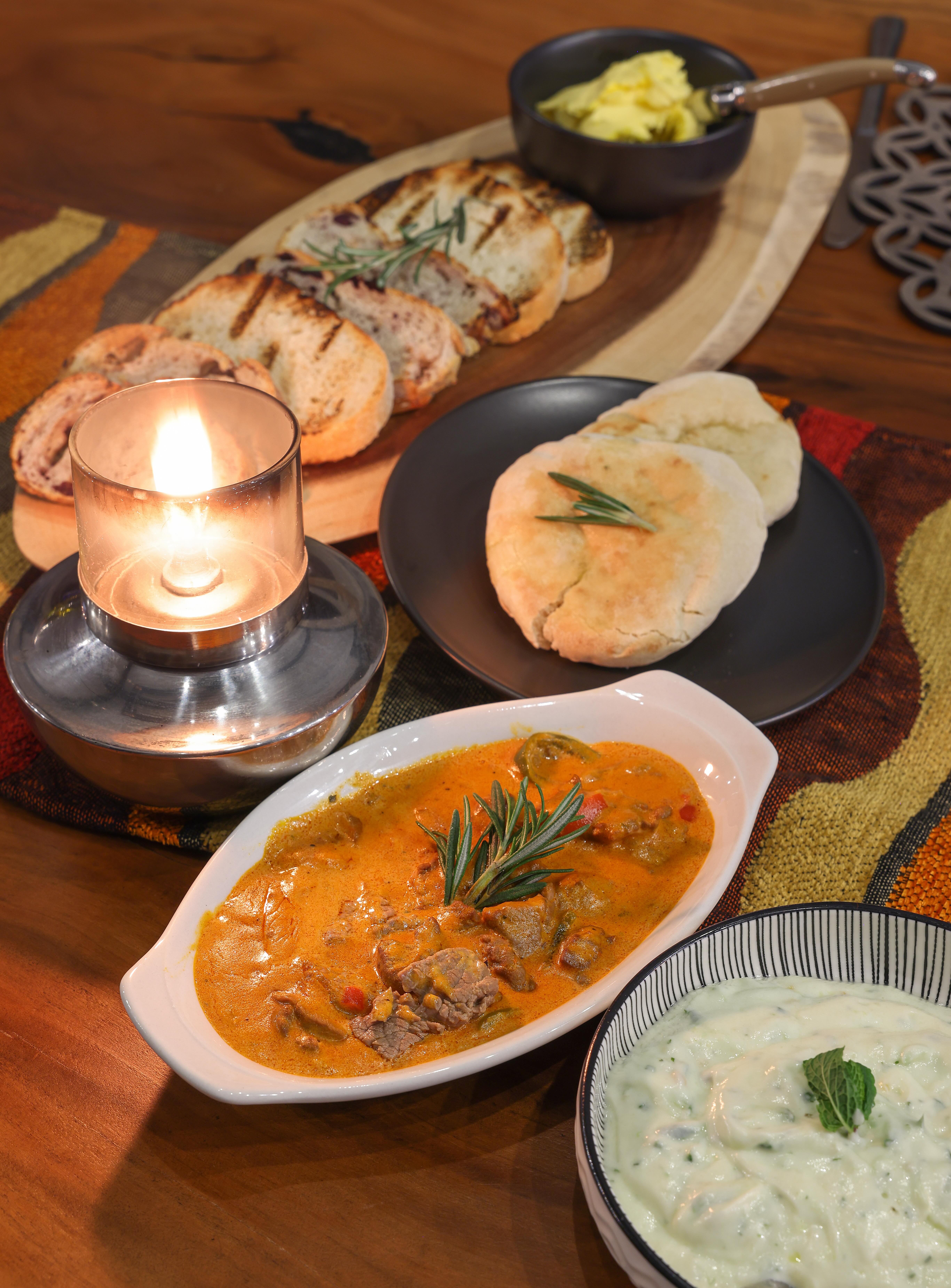 a plate of food and a candle