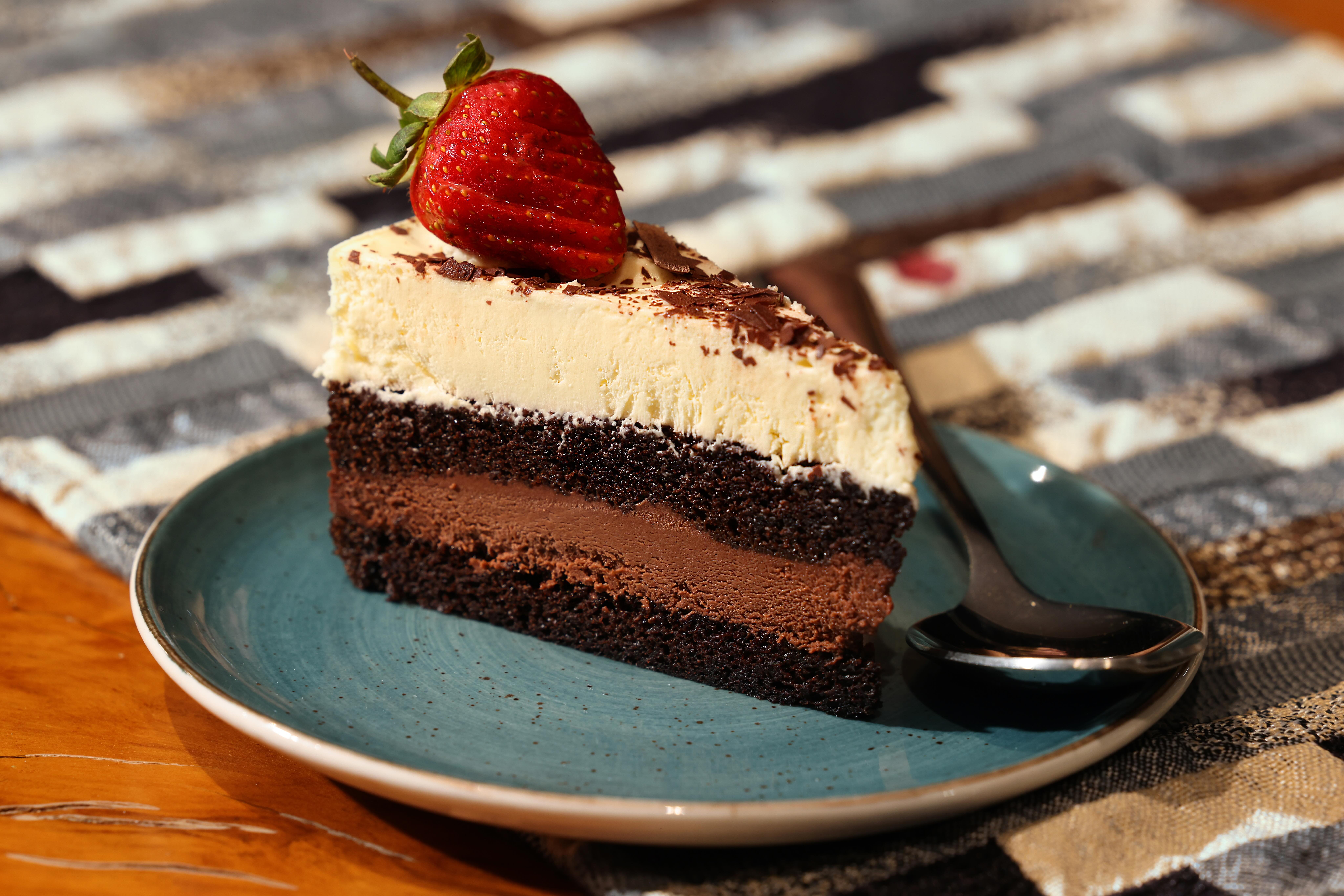 a piece of cake with a strawberry on top