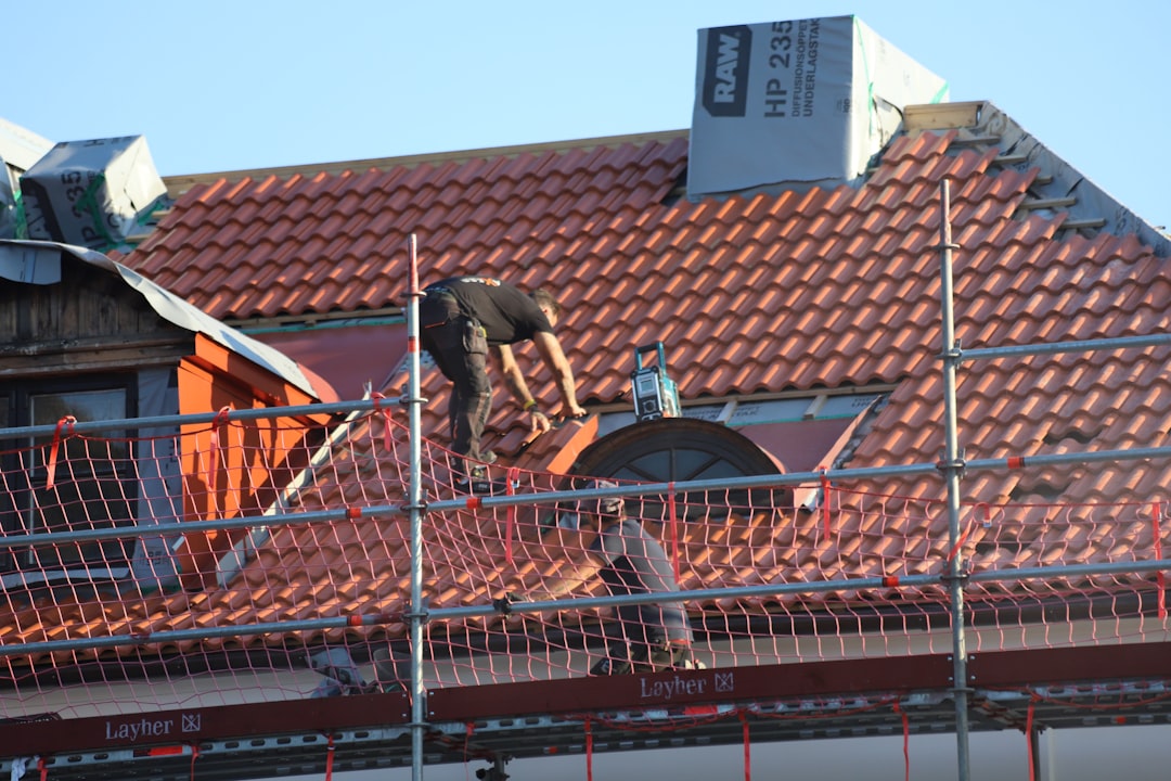 Technician assessing a commercial rooftop HVAC unit - Commercial ventilation Halifax Technician assessing a commercial rooftop HVAC unit - Commercial ventilation Halifax