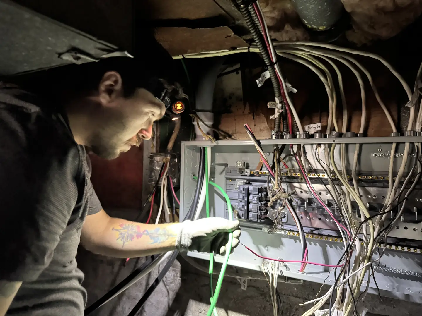 professional electrician performing a home electrical safety inspection in a residential home - best electrical in fall