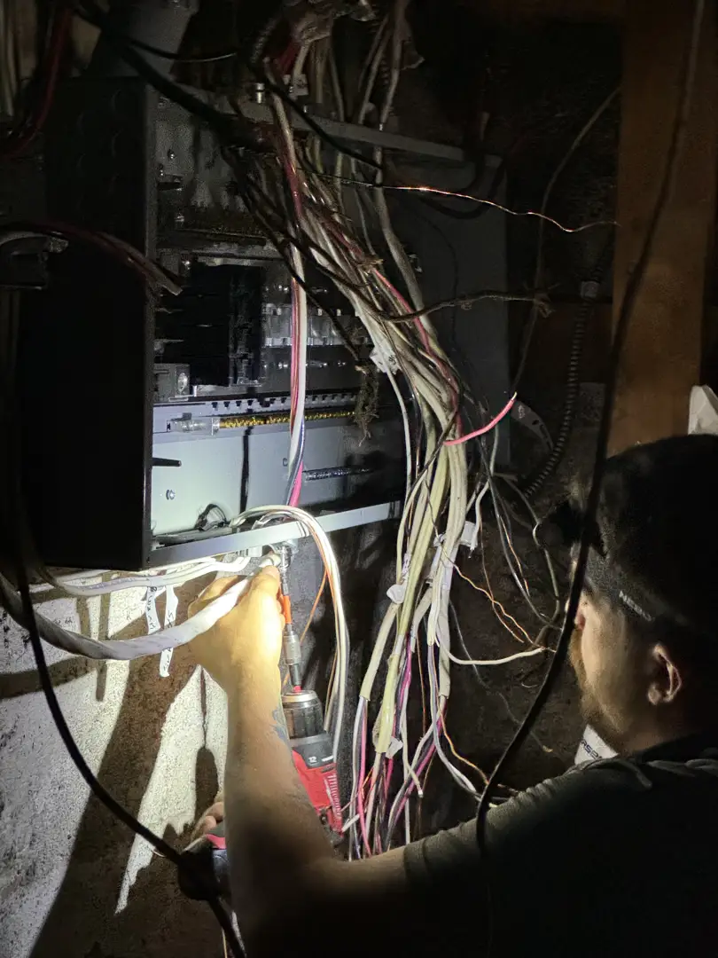 A modern residential electrical panel with clear labeling and professionally managed wiring A modern residential electrical panel with clear labeling and professionally managed wiring