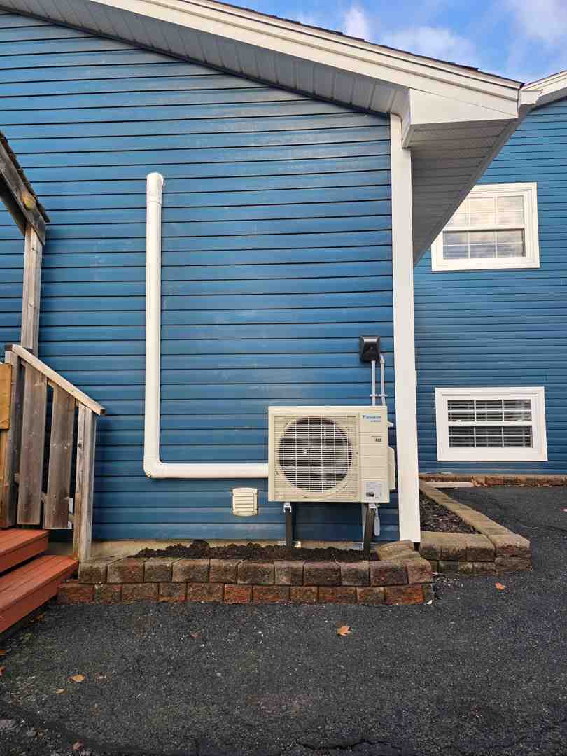 well-maintained heat pump in a residential yard - repair vs replace your heat pump decision guide