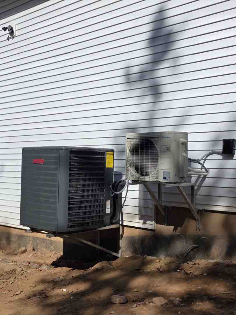 modern air conditioning unit in a coastal setting - summer cooling tips for maritime homeowners modern air conditioning unit in a coastal setting - summer cooling tips for maritime homeowners