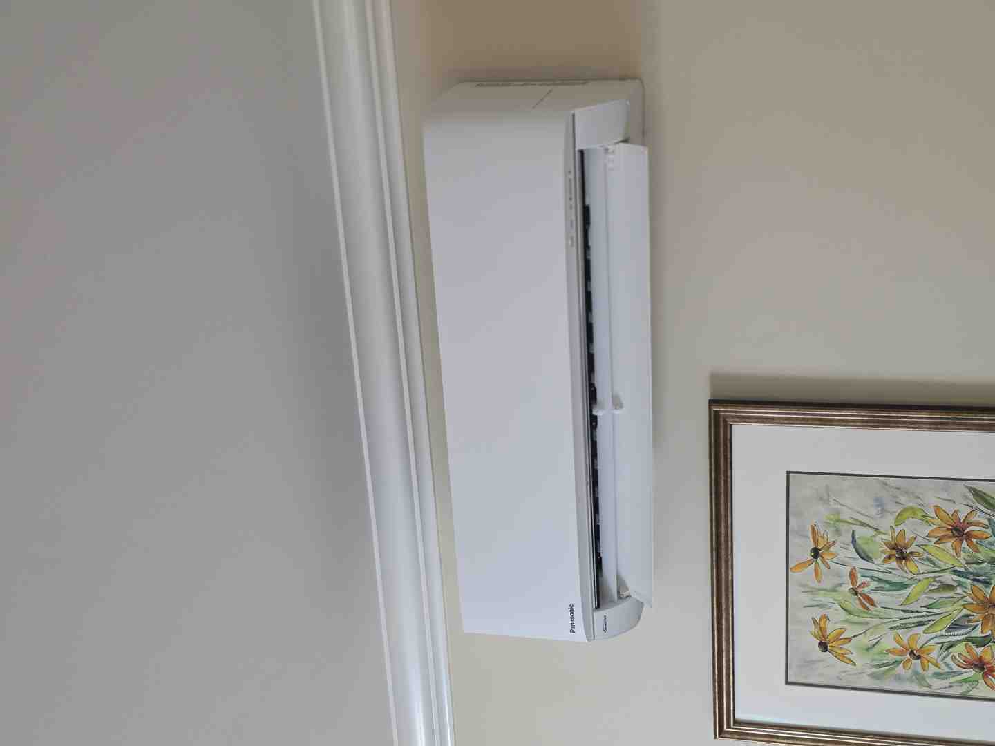 Family enjoying fresh indoor air in a clean modern living room - why your airtight home needs an hrv system Family enjoying fresh indoor air in a clean modern living room - why your airtight home needs an hrv system
