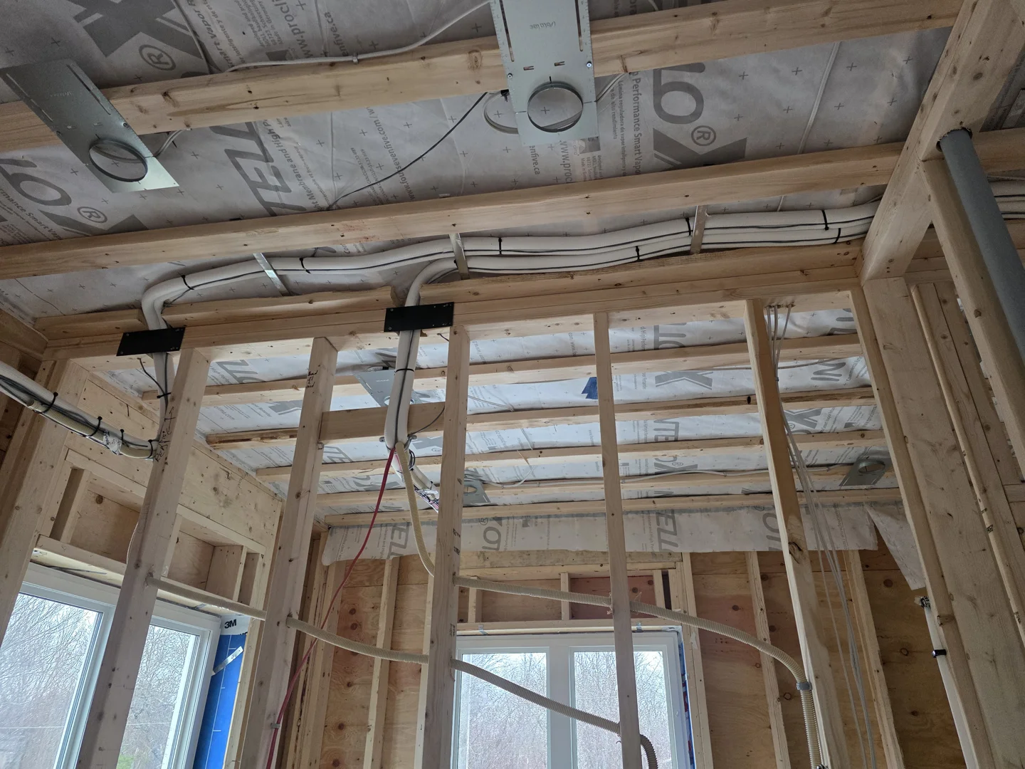 Custom ductwork installation in a residential build showing framing and rough-in sequencing