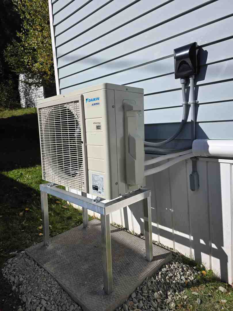 standby generator unit installed on a concrete pad outside a home standby generator unit installed on a concrete pad outside a home