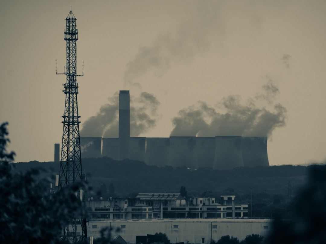 A large, complex industrial facility with multiple buildings and smoke stacks, indicating heavy machinery and processes. - Commercial ventilation solutions A large, complex industrial facility with multiple buildings and smoke stacks, indicating heavy machinery and processes. - Commercial ventilation solutions