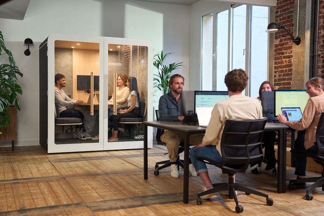Happy, productive employees in a well-ventilated office space - Commercial ventilation solutions Happy, productive employees in a well-ventilated office space - Commercial ventilation solutions