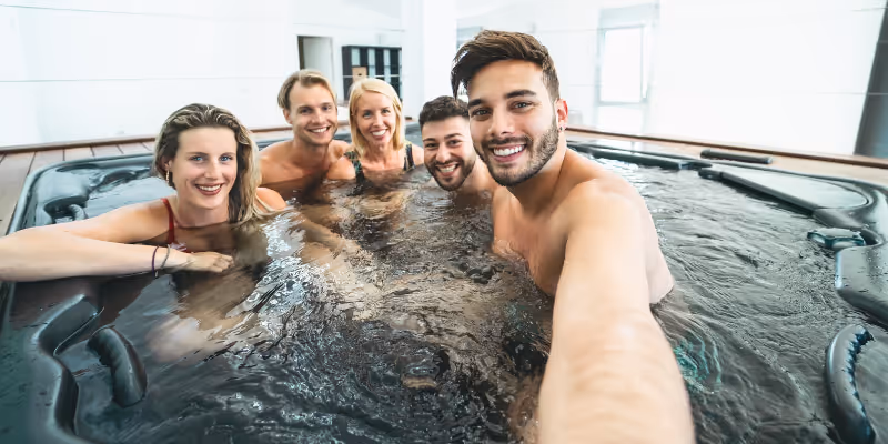 satisfied guests in a jacuzzi