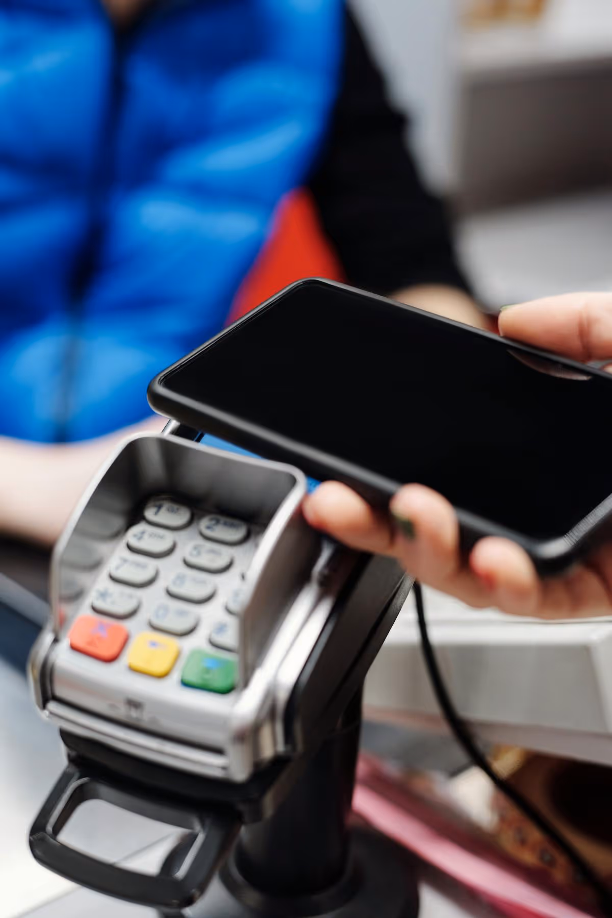 Guest making a contactless payment with smartphone for vacation rental services