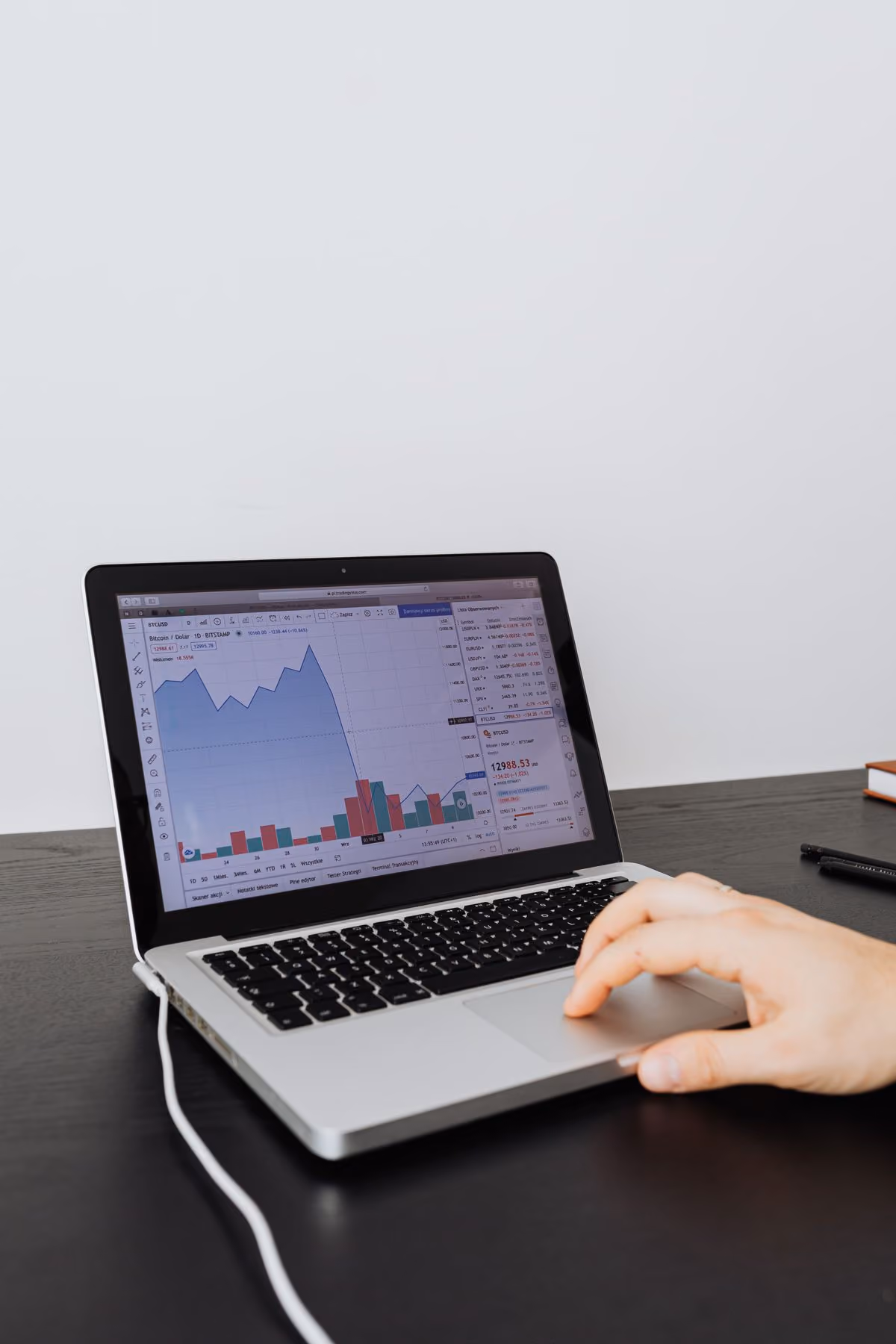 Host analyzing pricing data on a laptop for a new listing