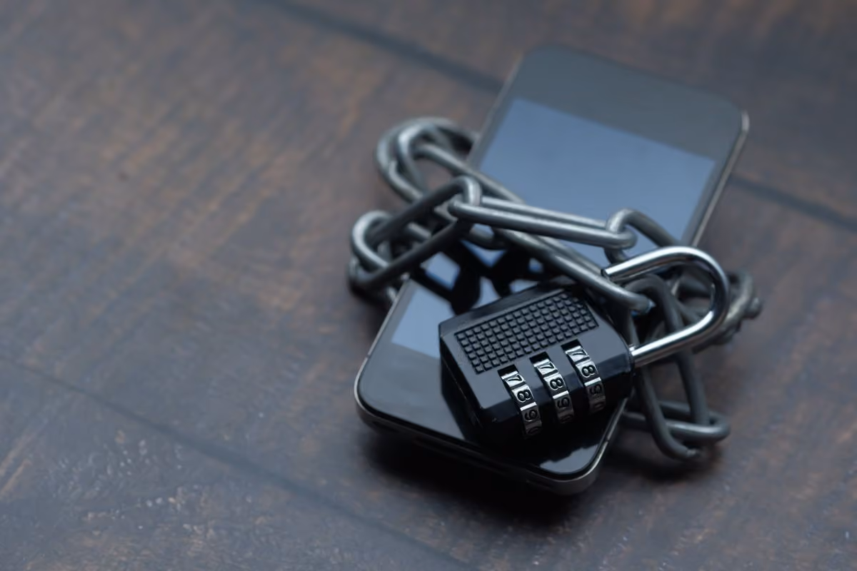 Smartphone wrapped in a chain symbolizing personal data privacy