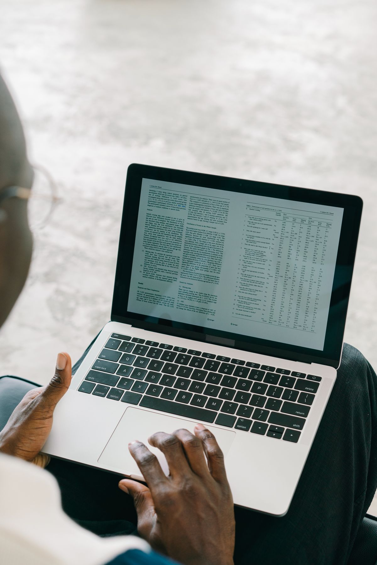 Person on a laptop reviewing an exported table of vacation rental bookings before leaving Smily