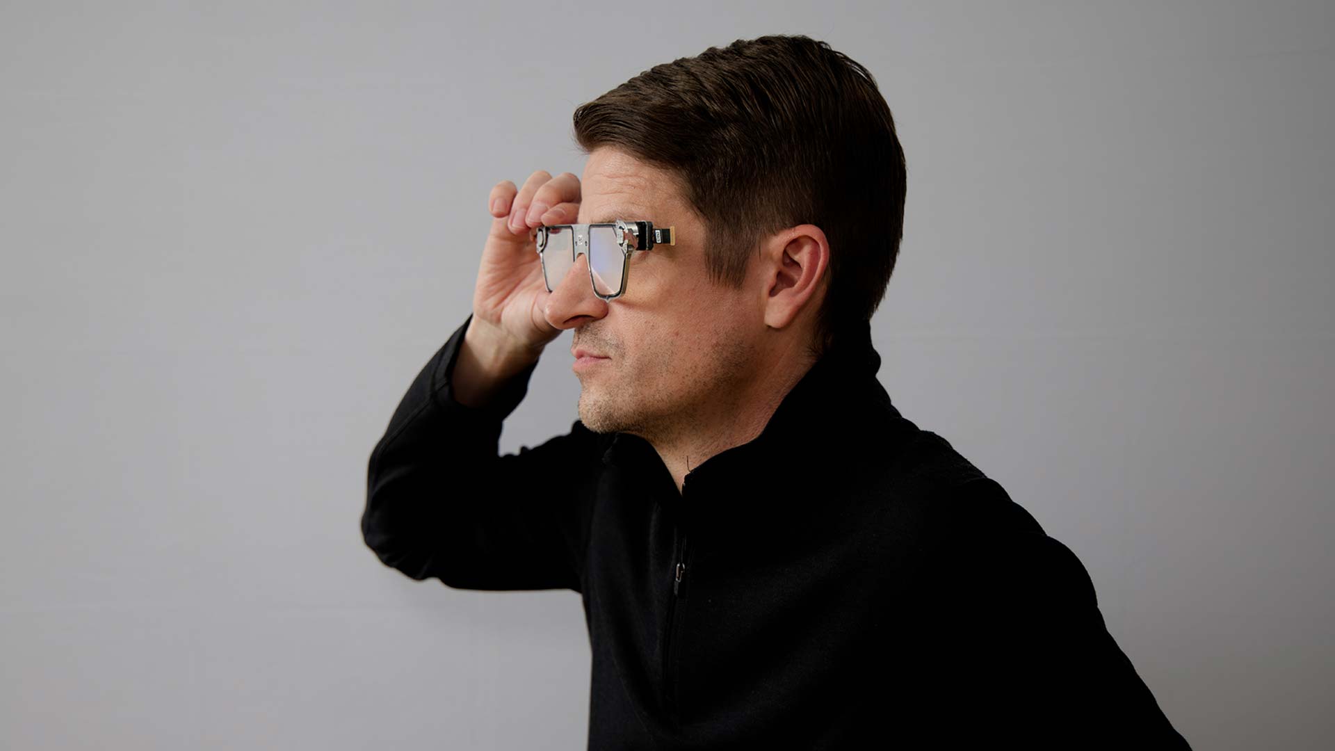 Magic Leap Engineer holds up an AR device prototype to test what’s possible.