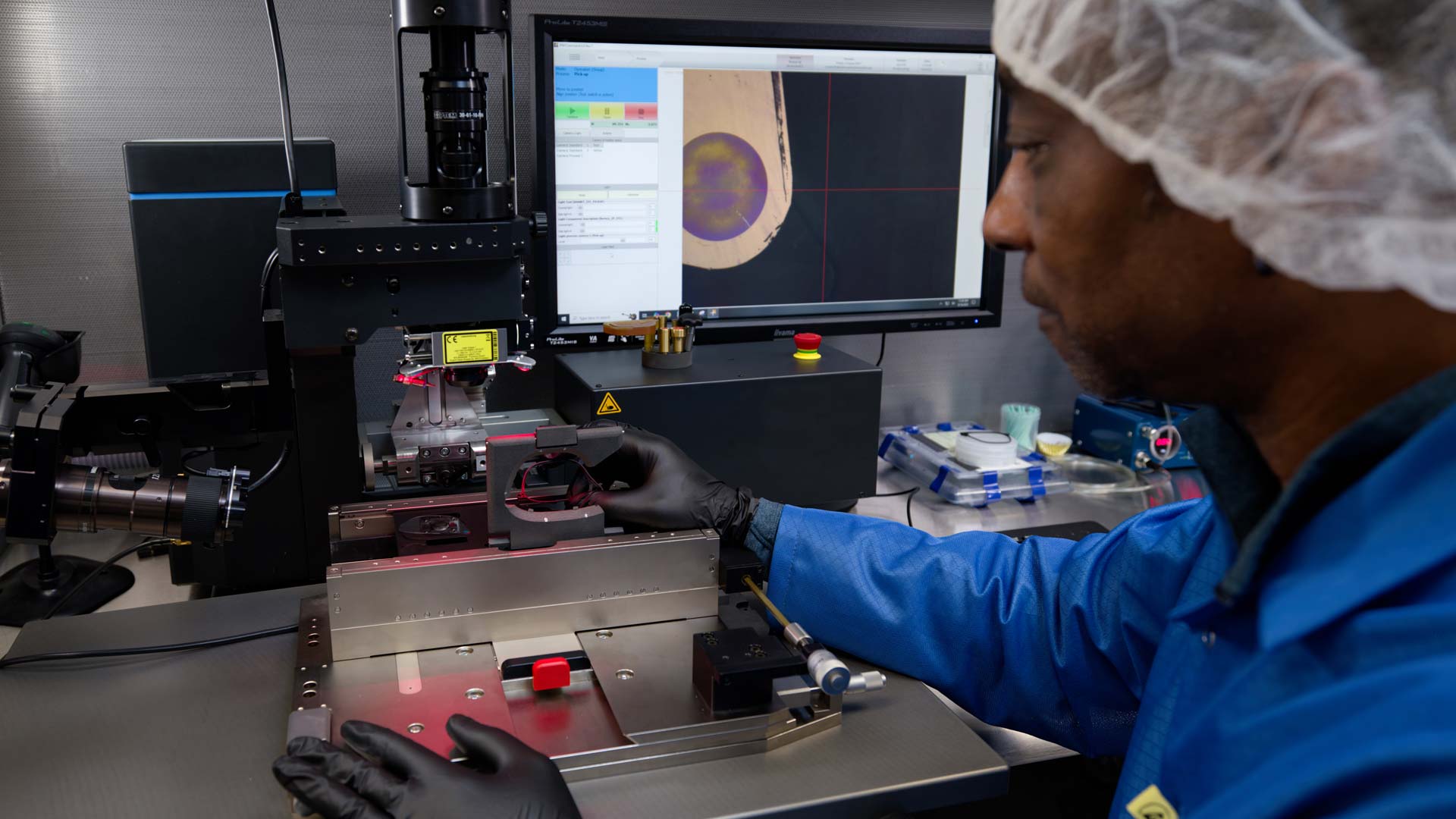 A Magic Leap employee inspects the incoupling grating region of a waveguide.