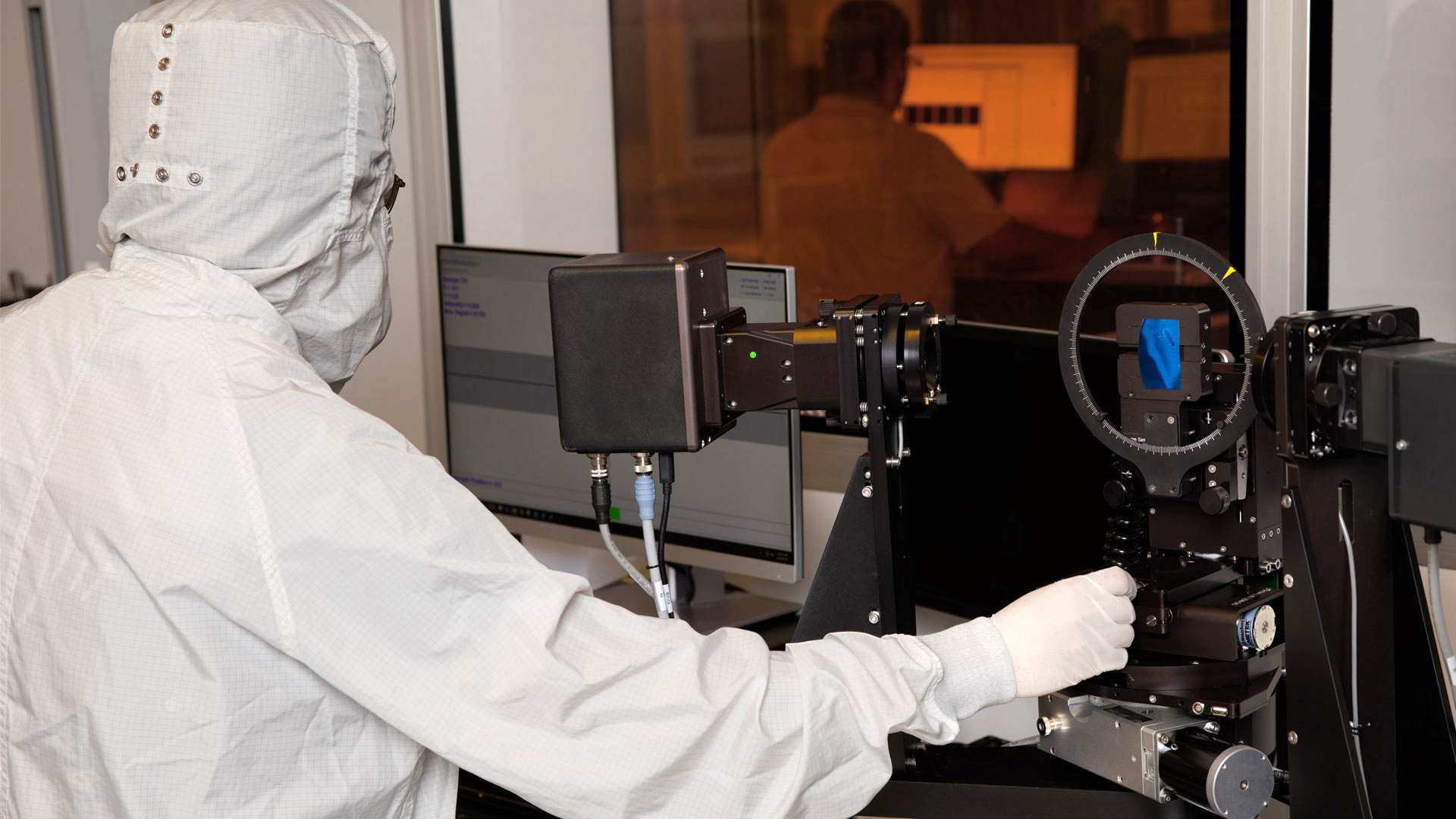 A Magic Leap engineer measures an AR waveguide substrate using precision optical metrology equipment.