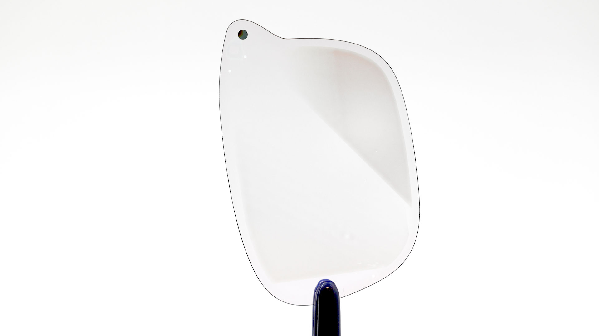 A Magic Leap waveguide, photographed at an angle, showcasing the slender profile of the waveguide.