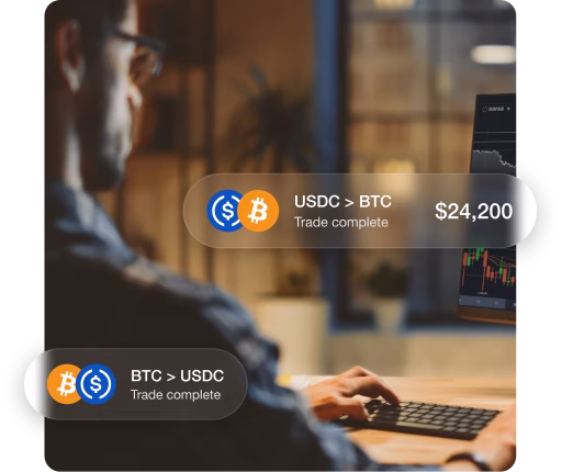 Image of a man looking at a digital exchange. There are overlay UI alerts of trades being completed.