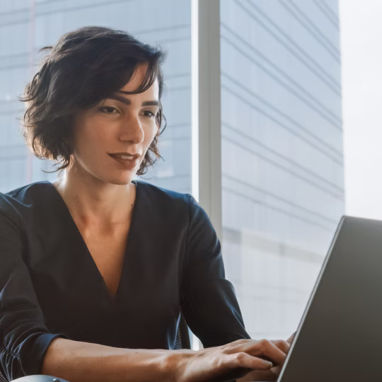 Woman looking at laptop