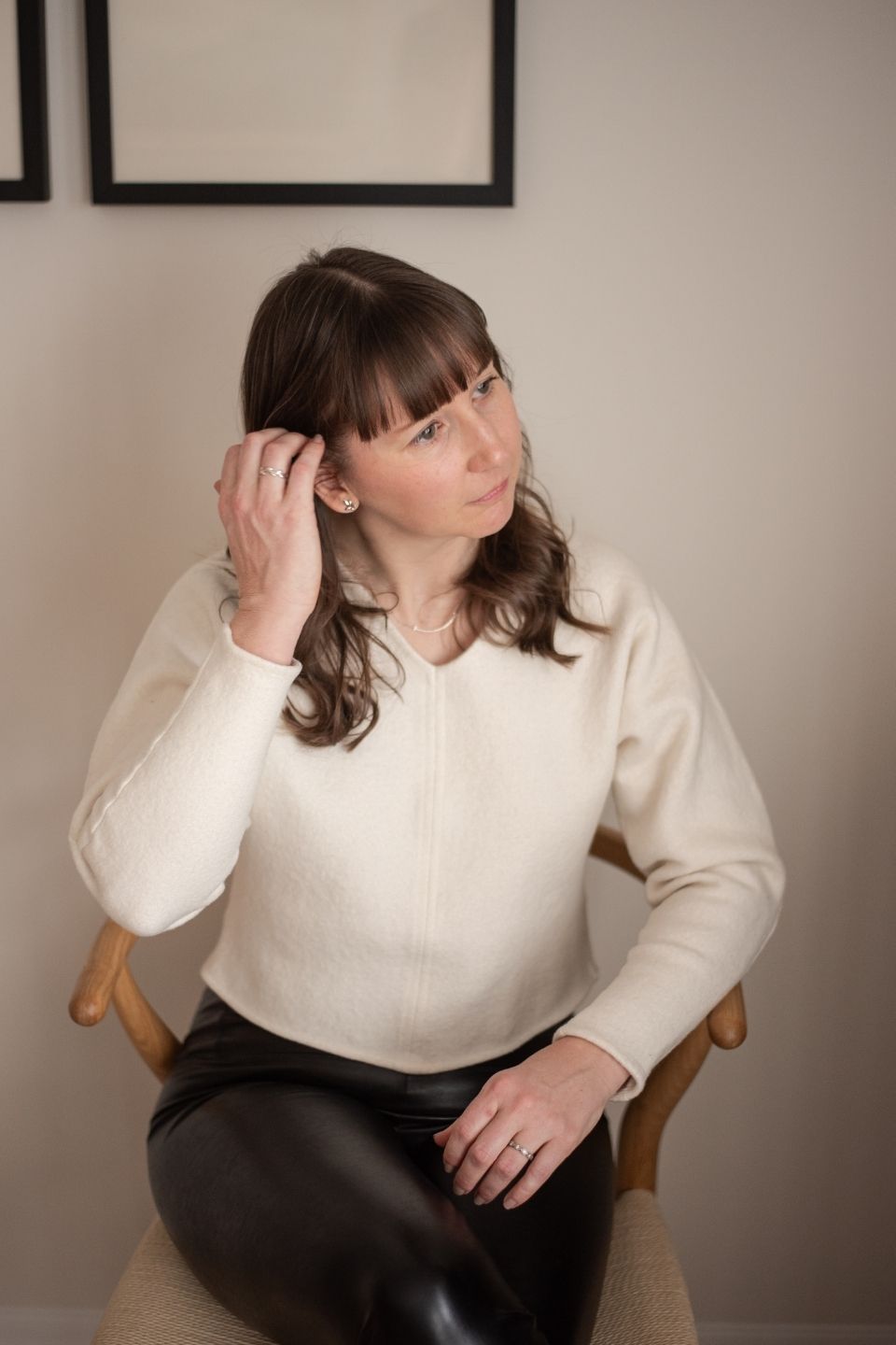 Megan Cook sitting in a chair looking off camera.