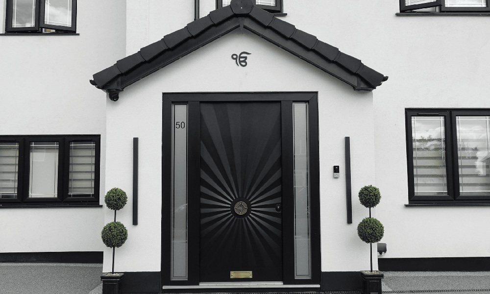 A modern front door canopy that blends in with the rest of the design of the home.