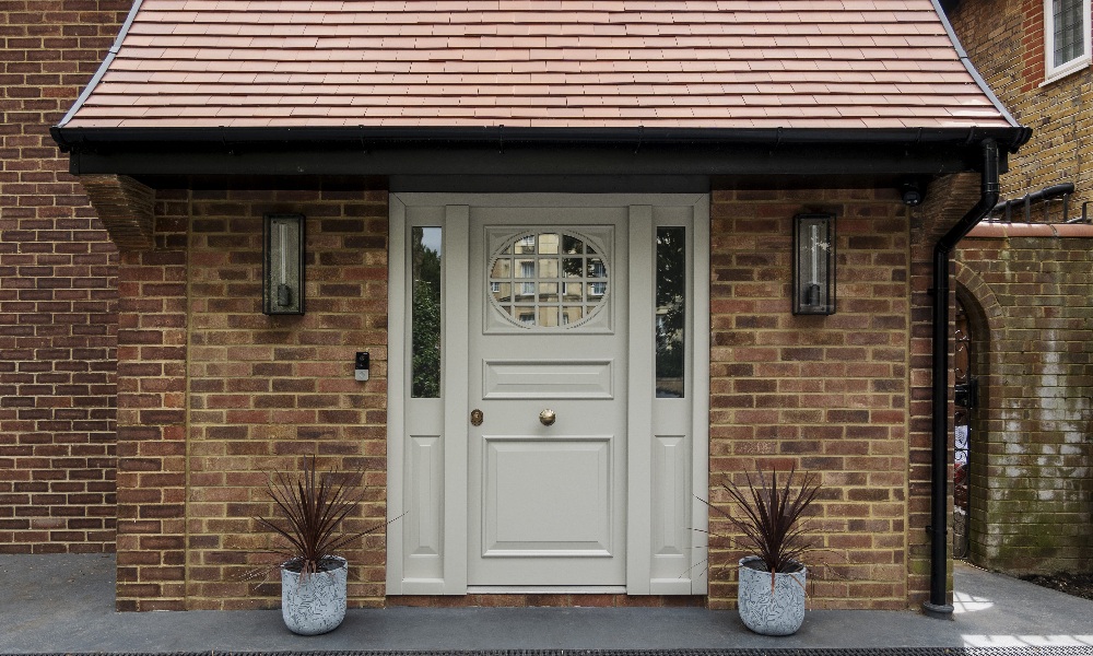 A front door canopy that mirror's the pitch of the roof of the house.