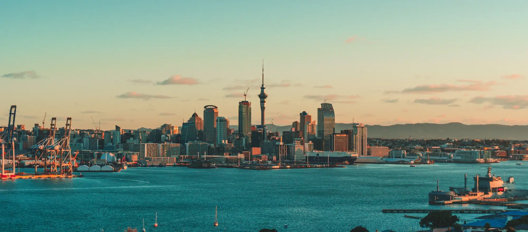 Photo of Auckland New Zealand city skyline taken during a sunset