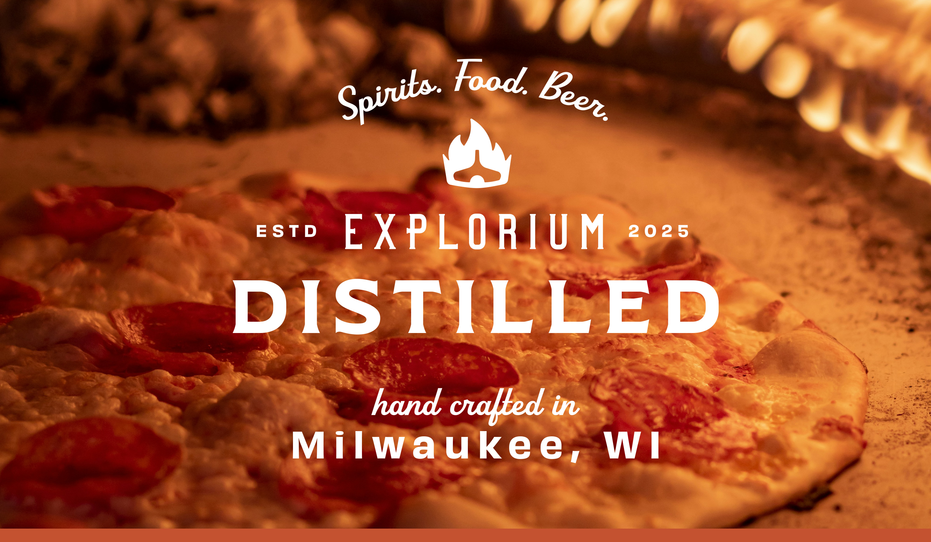 Explorium Distilled Milwaukee Expanded Logo Over Pizza Background