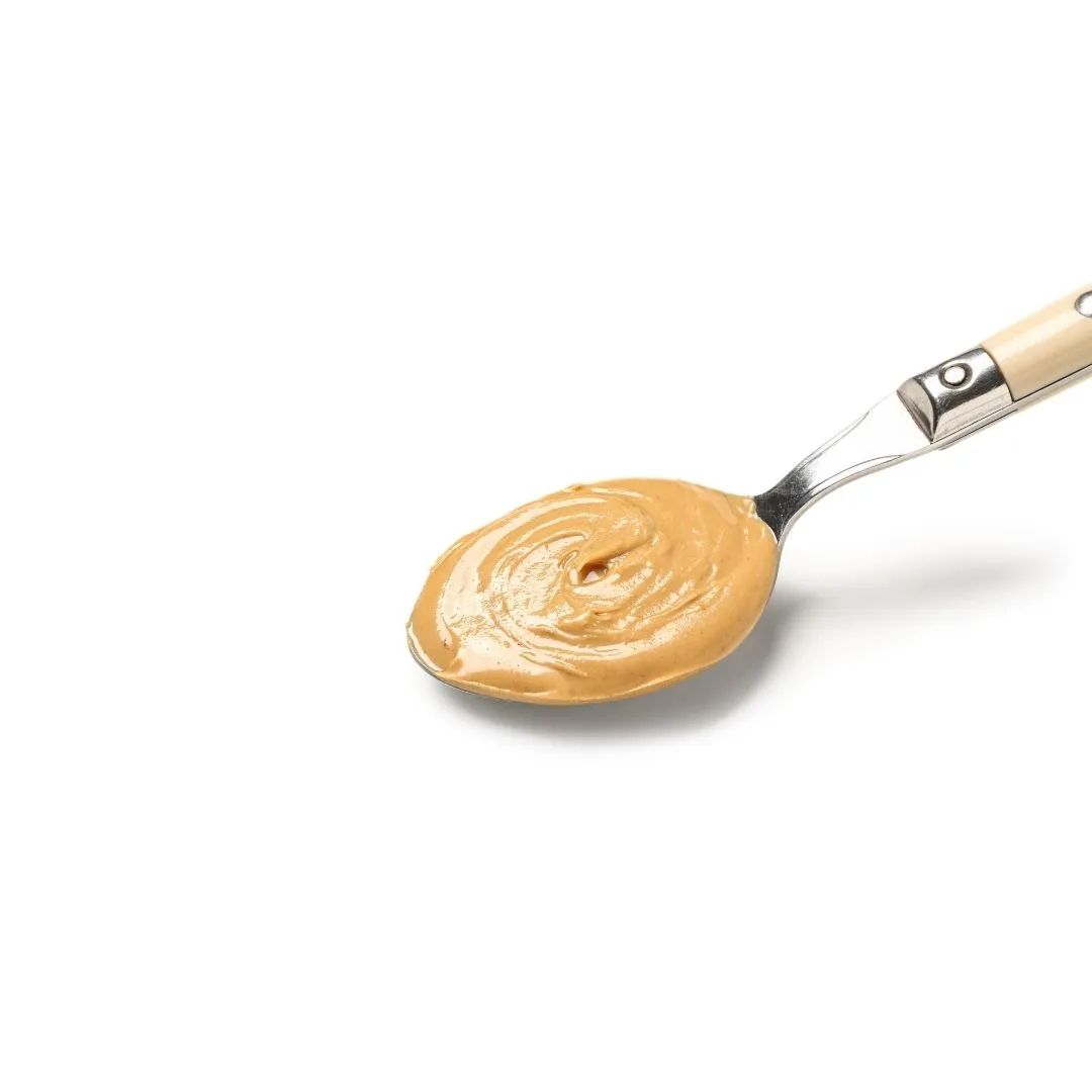 Burger with fried fries on black plate with sauce on the side