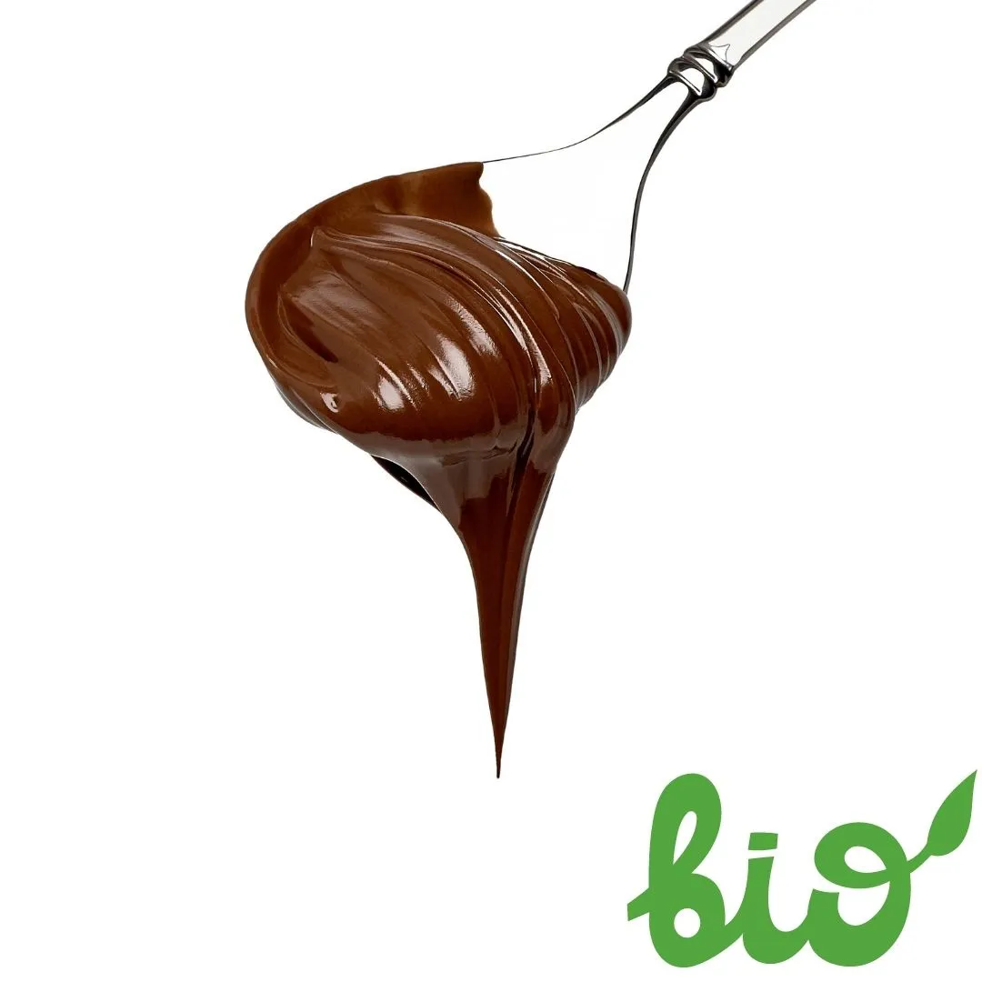 Burger with fried fries on black plate with sauce on the side