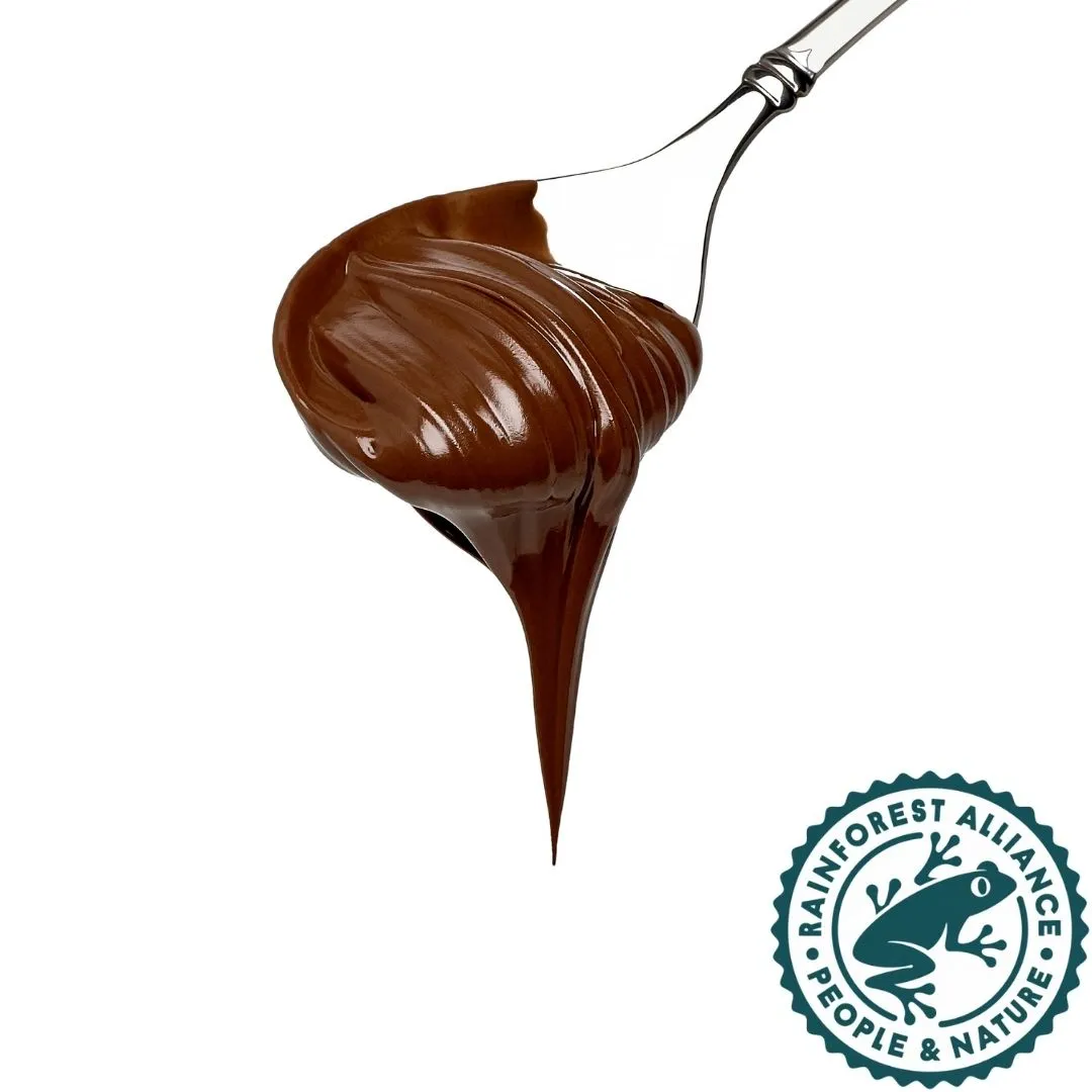 Burger with fried fries on black plate with sauce on the side