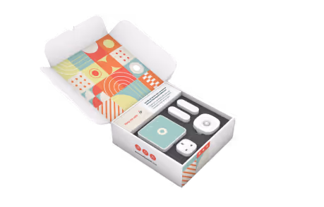 Smiling young man wearing glasses hugging his smiling grandparent 