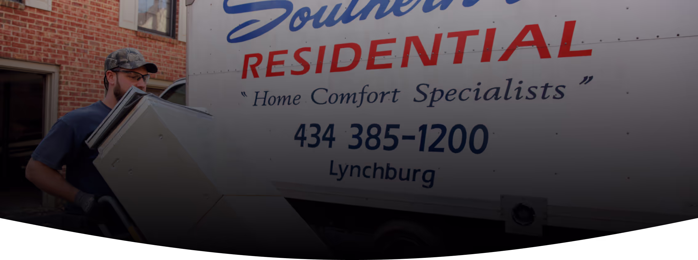 Southern Air, Inc. Team Member Carrying HVAC Unit