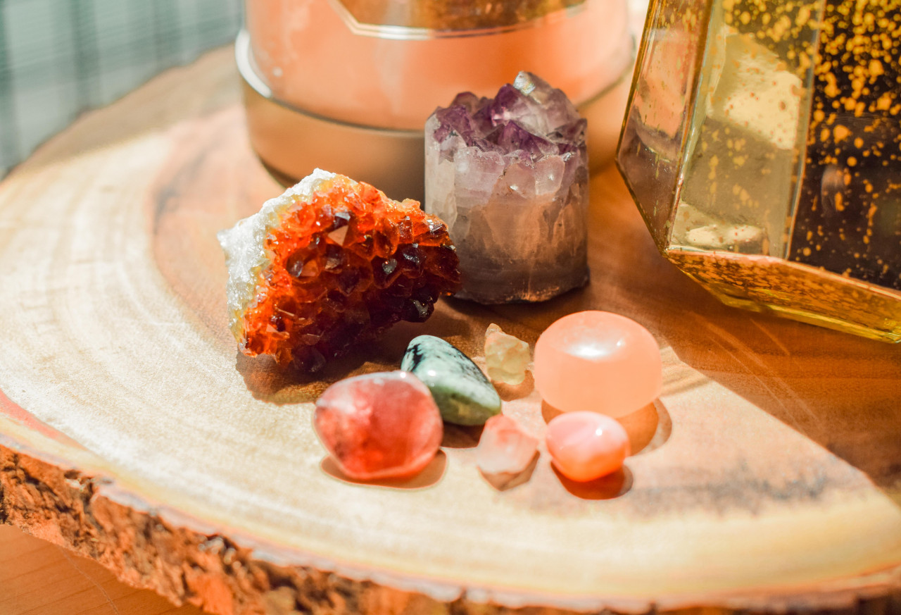 Crystals sitting on a wooden table