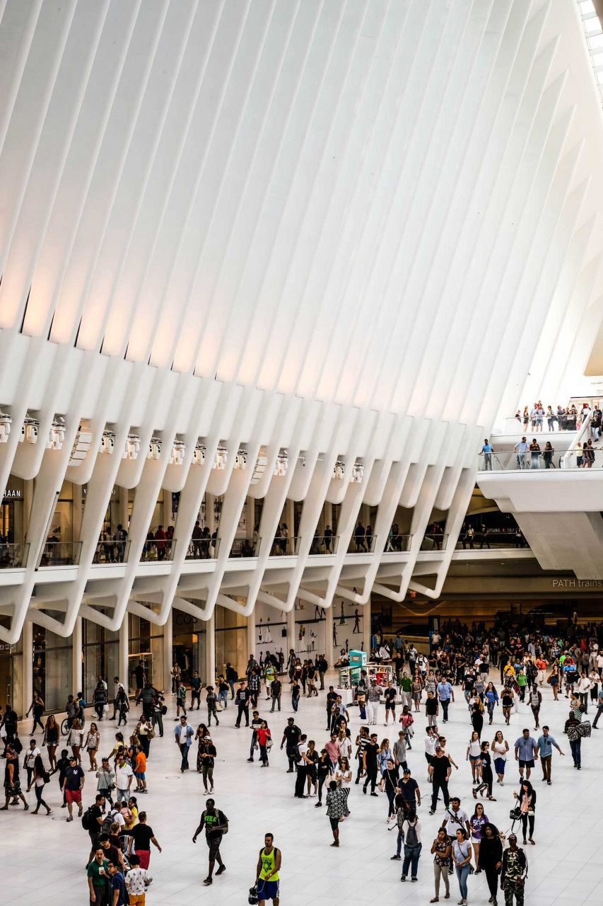 a large space with a crowd walking around