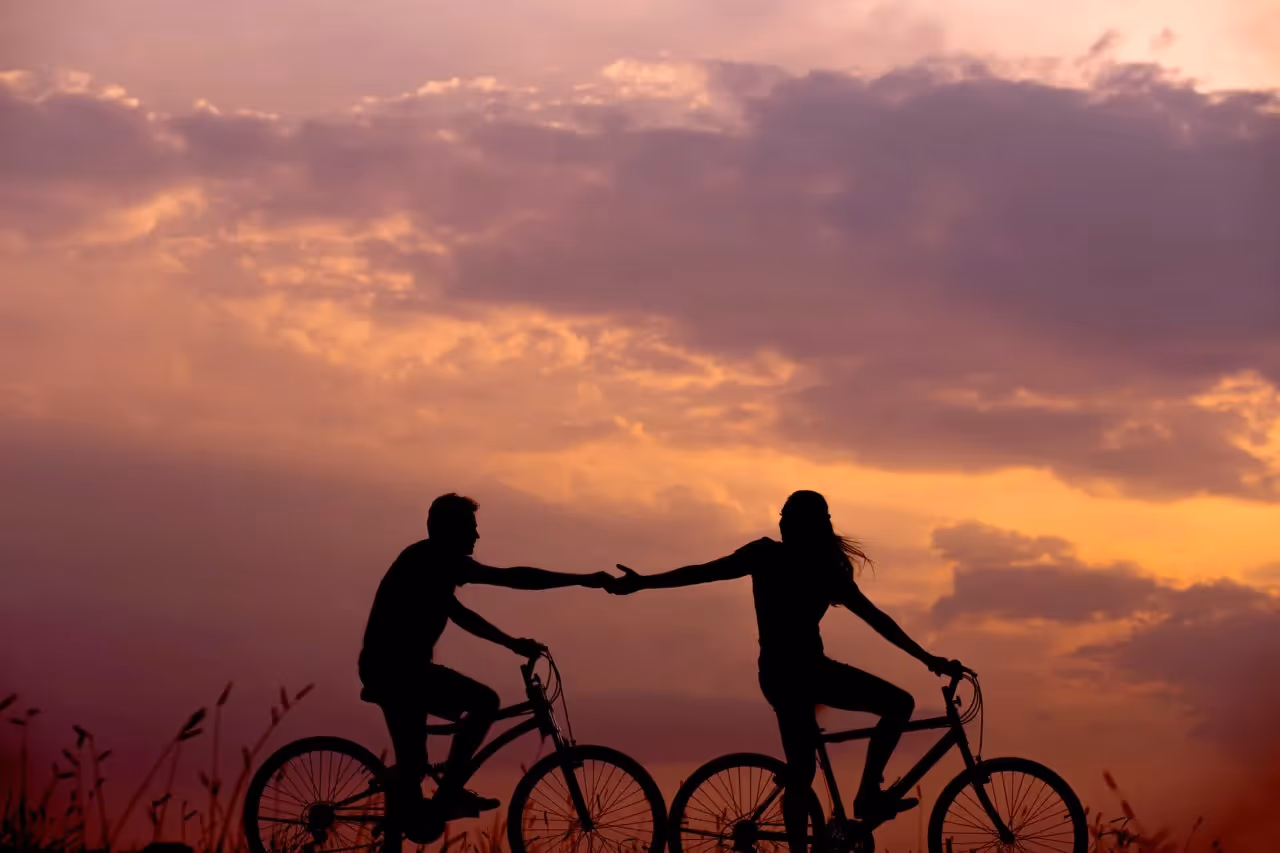 a couple on a bicycle