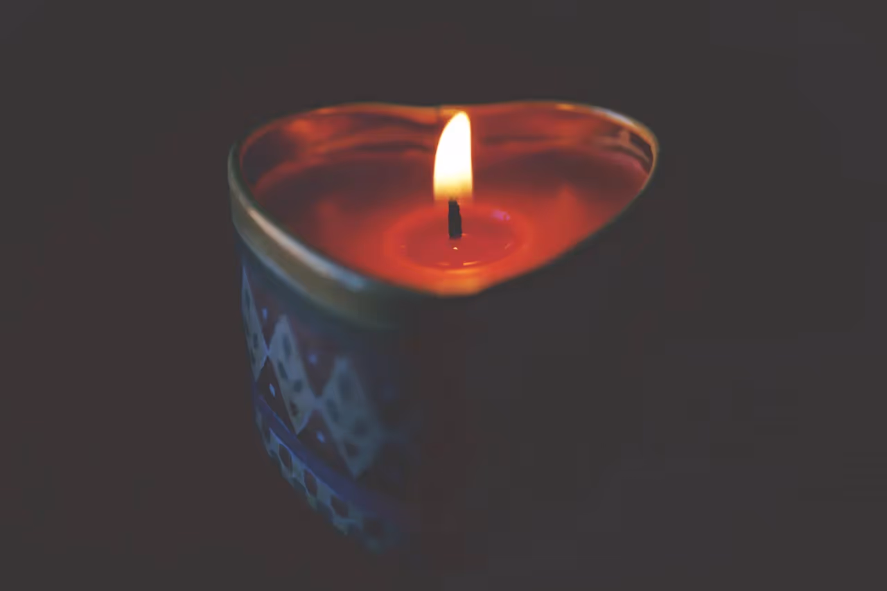 a lit heart-shaped candle