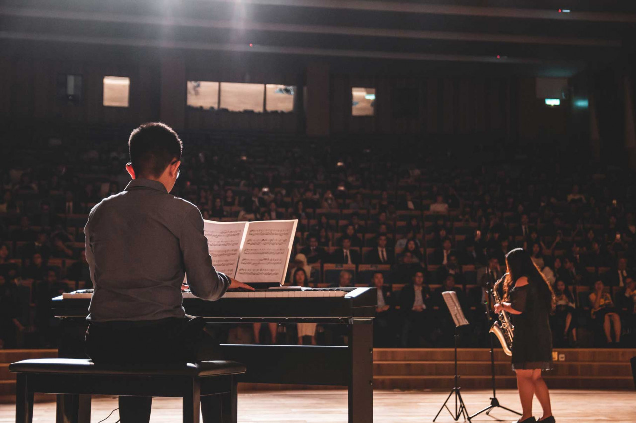 two people performing a concert