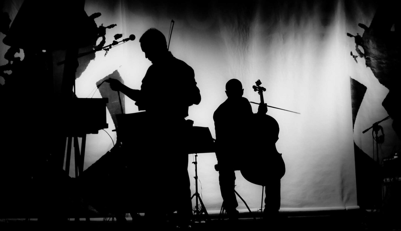 shadow figured holding music instruments